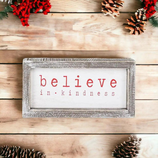 Believe Sign rustic gray frame white panel with red believe in kindness text on Tampa Home & Garden Store