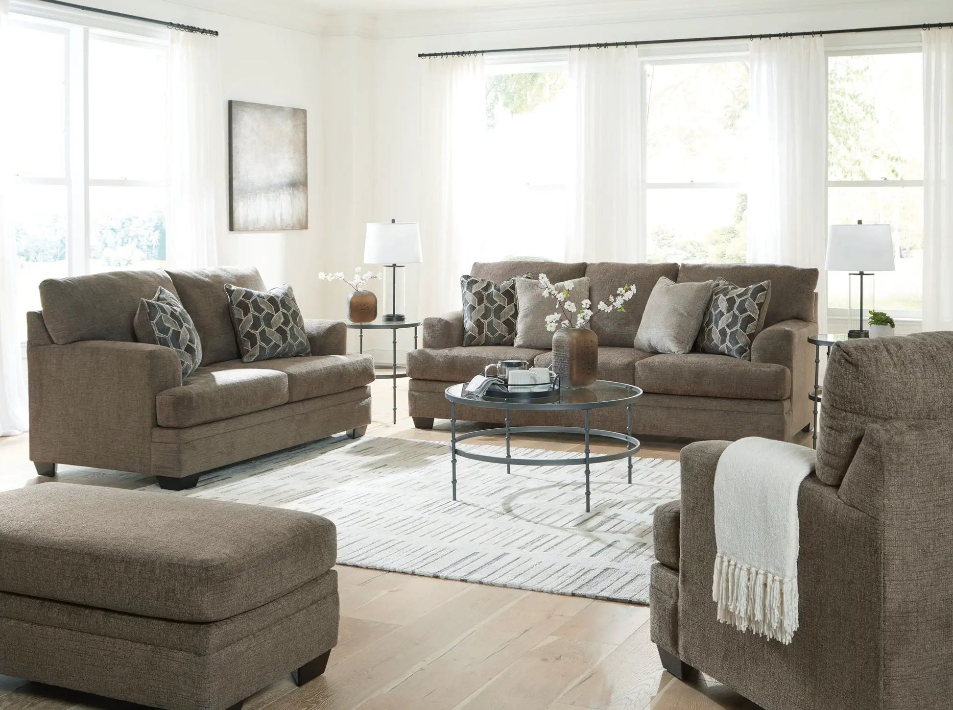 Stonemeade 3-piece living room set in taupe fabric with geometric pillows; two sofas & ottoman on Tampa Home & Garden Store