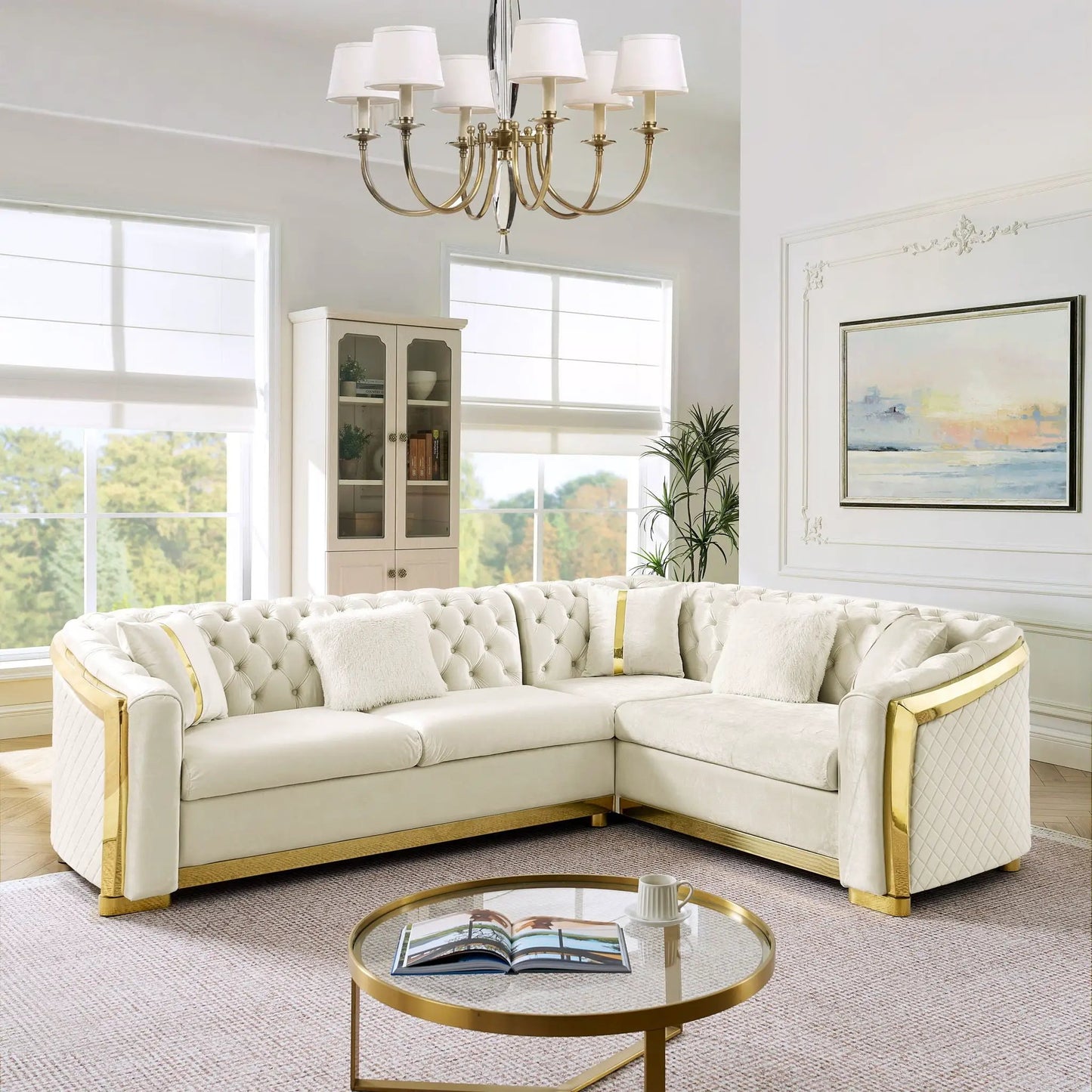 L-shaped Chesterfield sectional sofa in cream upholstery with gold frame and stainless accents on Tampa Home & Garden Store