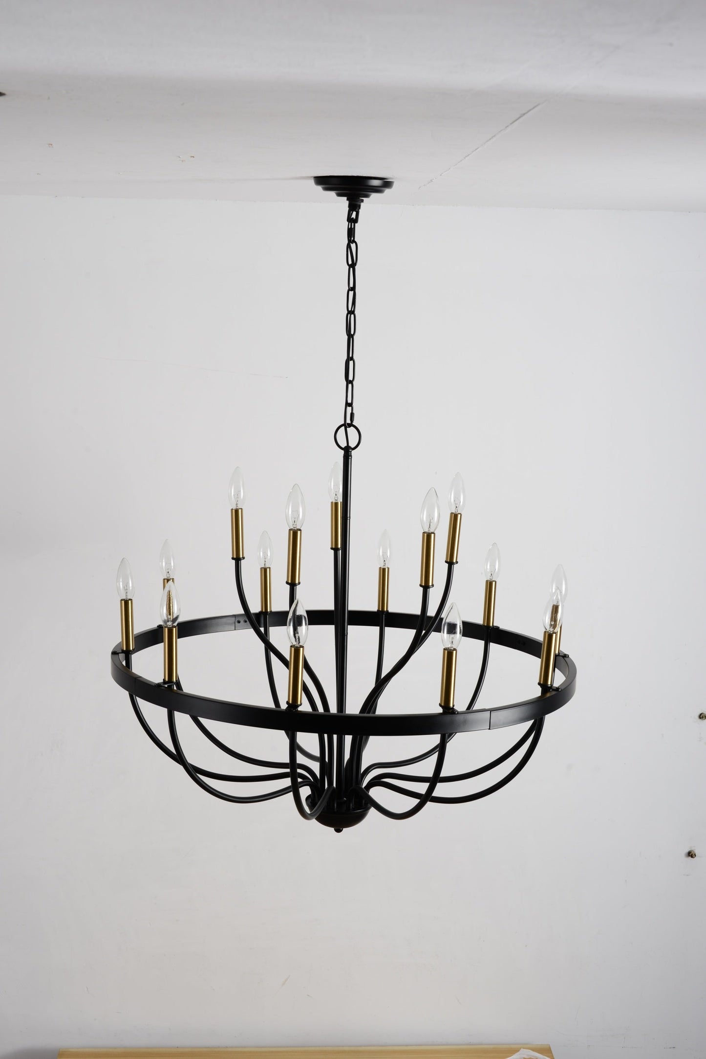 18-Light industrial iron chandelier with black frame and gold candle sleeves, chain-hung on Tampa Home & Garden Store
