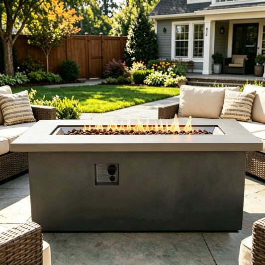 Outdoor 60-inch dark grey concrete fire pit table with flames on a modern backyard patio on Tampa Home & Garden Store