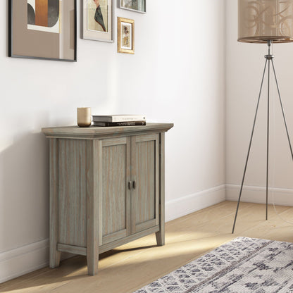 Redmond handcrafted low storage cabinet in distressed blue-washed wood with two doors on Tampa Home & Garden Store