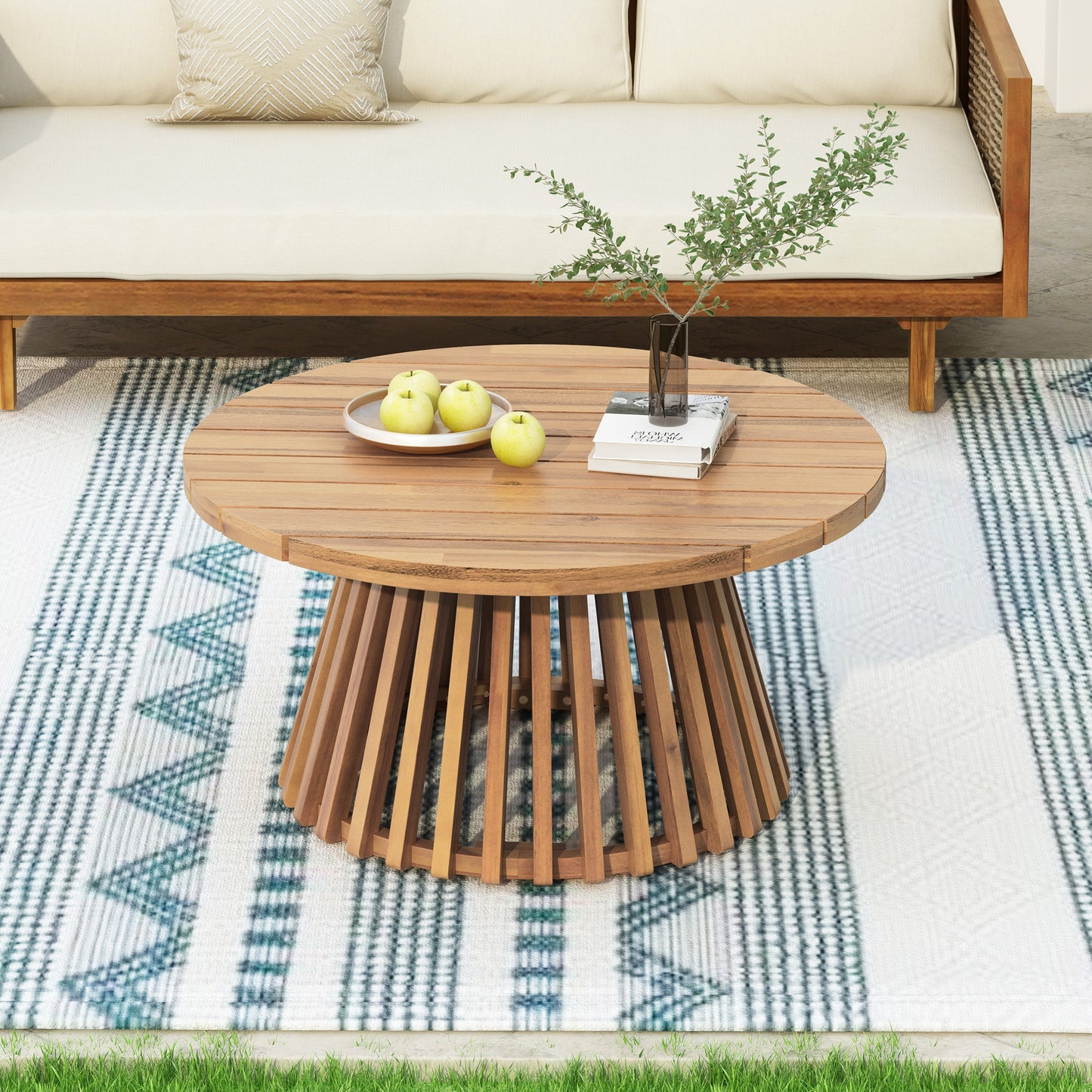 Acacia wood patio coffee table with round slatted top and pedestal base in warm brown on Tampa Home & Garden Store