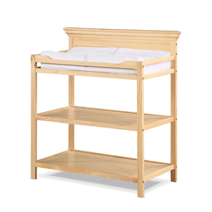 Universal Changing Table in natural pine with white cushioned pad on Tampa Home & Garden Store