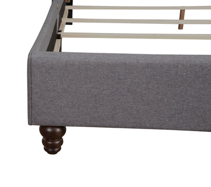 Nailhead Bed upholstered in gray fabric with light wood slats and dark bun feet HouseOfZazla on Tampa Home & Garden Store