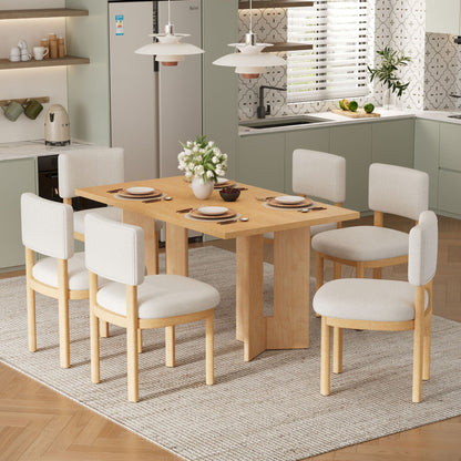 Dining table set with six upholstered chairs around a light wood table on Tampa Home & Garden Store