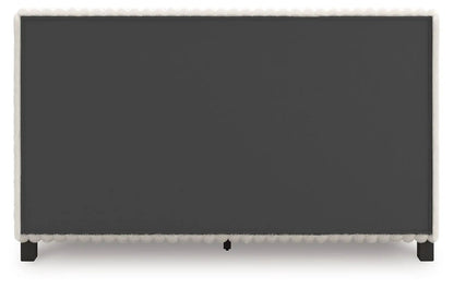 Zuraleus upholstered bed in charcoal gray fabric with white faux fur trim and wood legs on Tampa Home & Garden Store