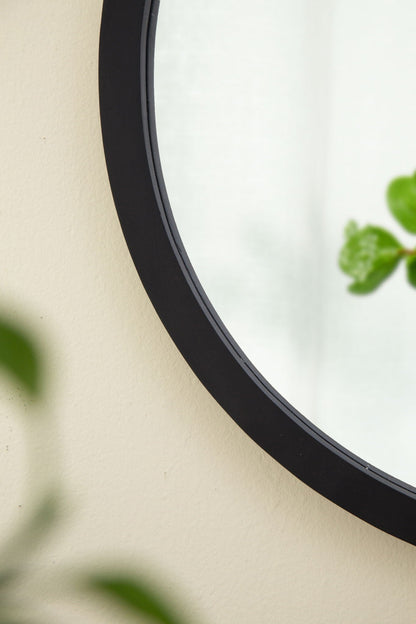 Circle wall mirror with black wooden frame for living room on beige wall HouseOfZazla on Tampa Home & Garden Store