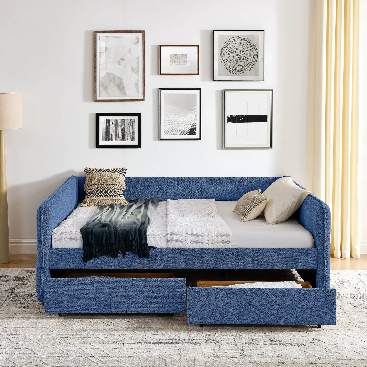 Upholstered blue daybed with 2 storage drawers and white bedding on Tampa Home & Garden Store