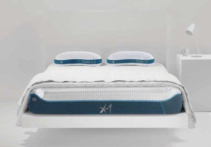 BedGear X-1 Edge boxed full mattress on white platform bed with blue trim and two pillows on Tampa Home & Garden Store