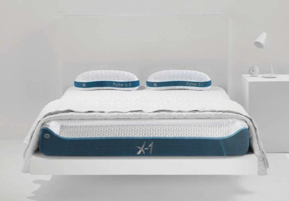 BedGear X-1 Edge boxed full mattress on white platform bed with blue trim and two pillows on Tampa Home & Garden Store