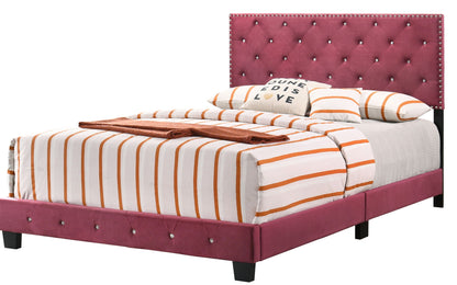 Luxurious Upholstered Bed in magenta velvet with tufted headboard, orange striped bedding on Tampa Home & Garden Store