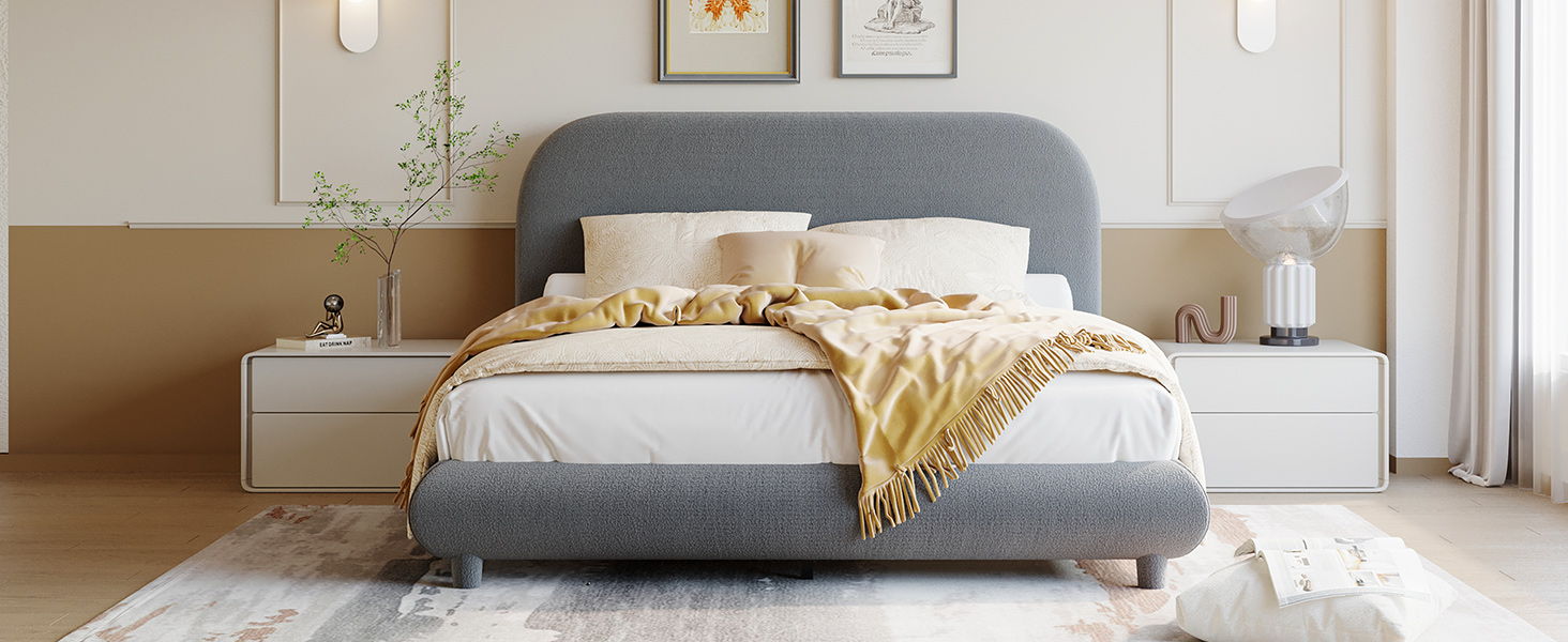 Upholstered platform bed with thick gray curved headboard and two white nightstands on Tampa Home & Garden Store