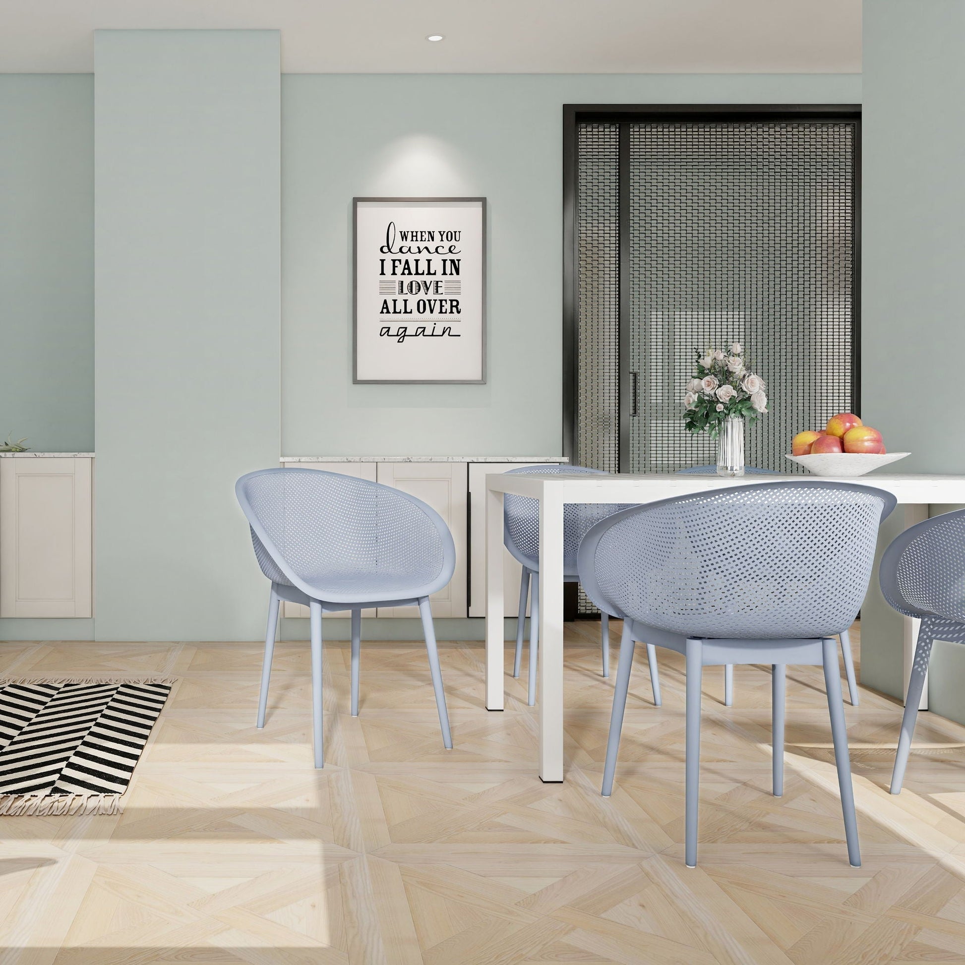2-piece hollow-out design kid chairs in light blue-gray with perforated backs at a white table on Tampa Home & Garden Store