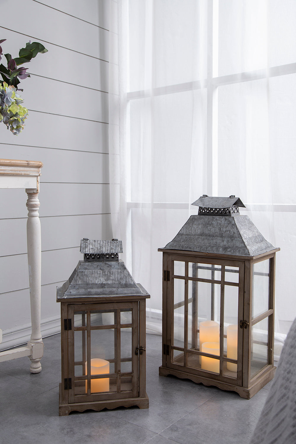 S/2 Classic Scape Lanterns pair of wooden lanterns with metal roofs and lit candles on Tampa Home & Garden Store