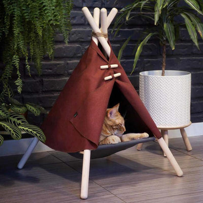 Cat tent bed frame in rust-red fabric with light wood poles, cat resting inside on Tampa Home & Garden Store