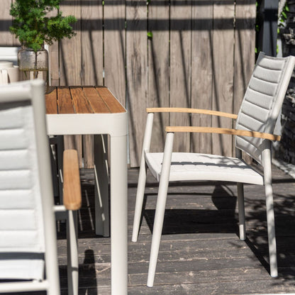 Portals Light Lite 2pc stacking outdoor chairs in light gray weave with wood armrests on Tampa Home & Garden Store