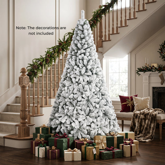 Snow-flocked 9 ft artificial Christmas tree with metal stand by DirectDeals in living room on Tampa Home & Garden Store