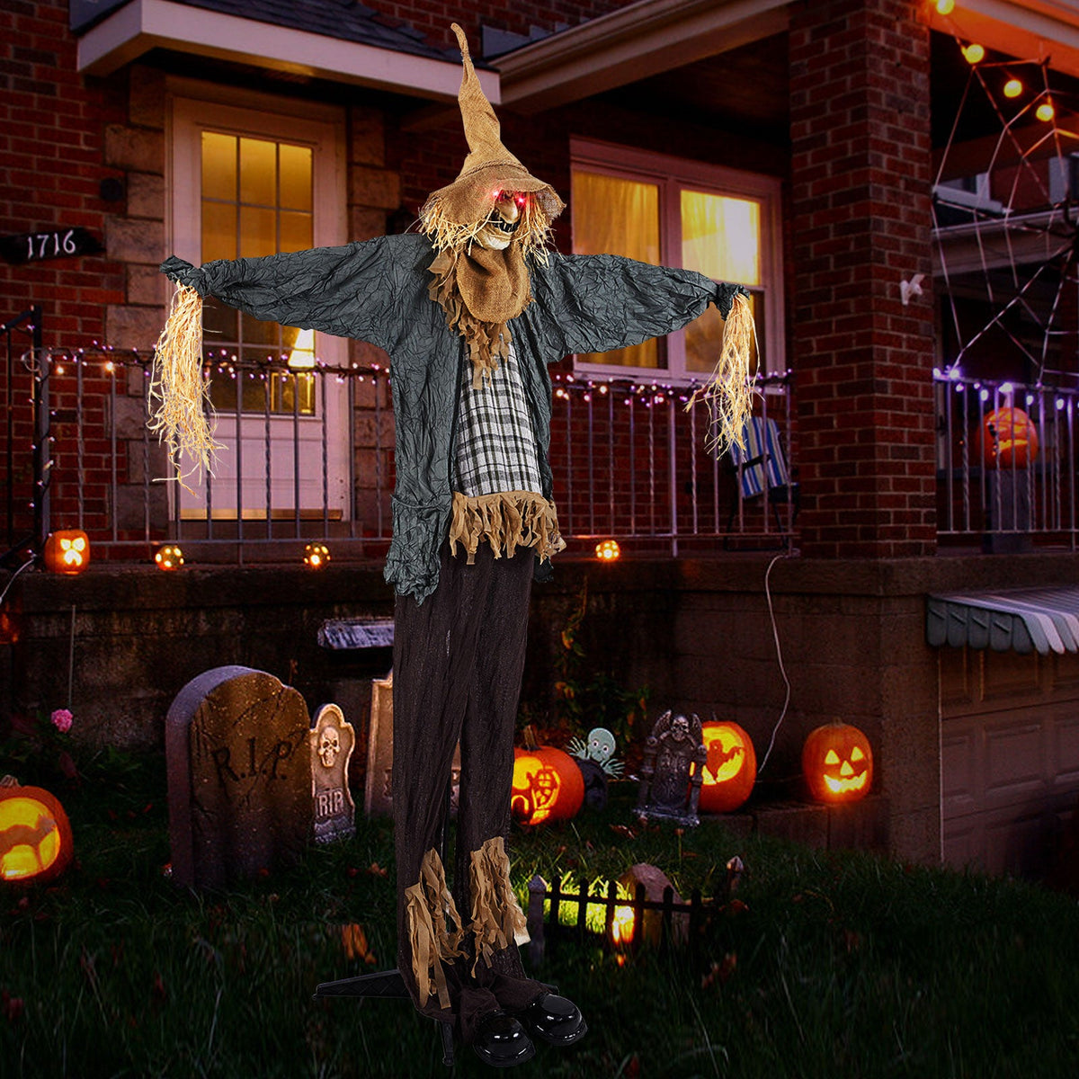 7 ft animated Halloween scarecrow with light-up eyes and tattered burlap cloak on Tampa Home & Garden Store