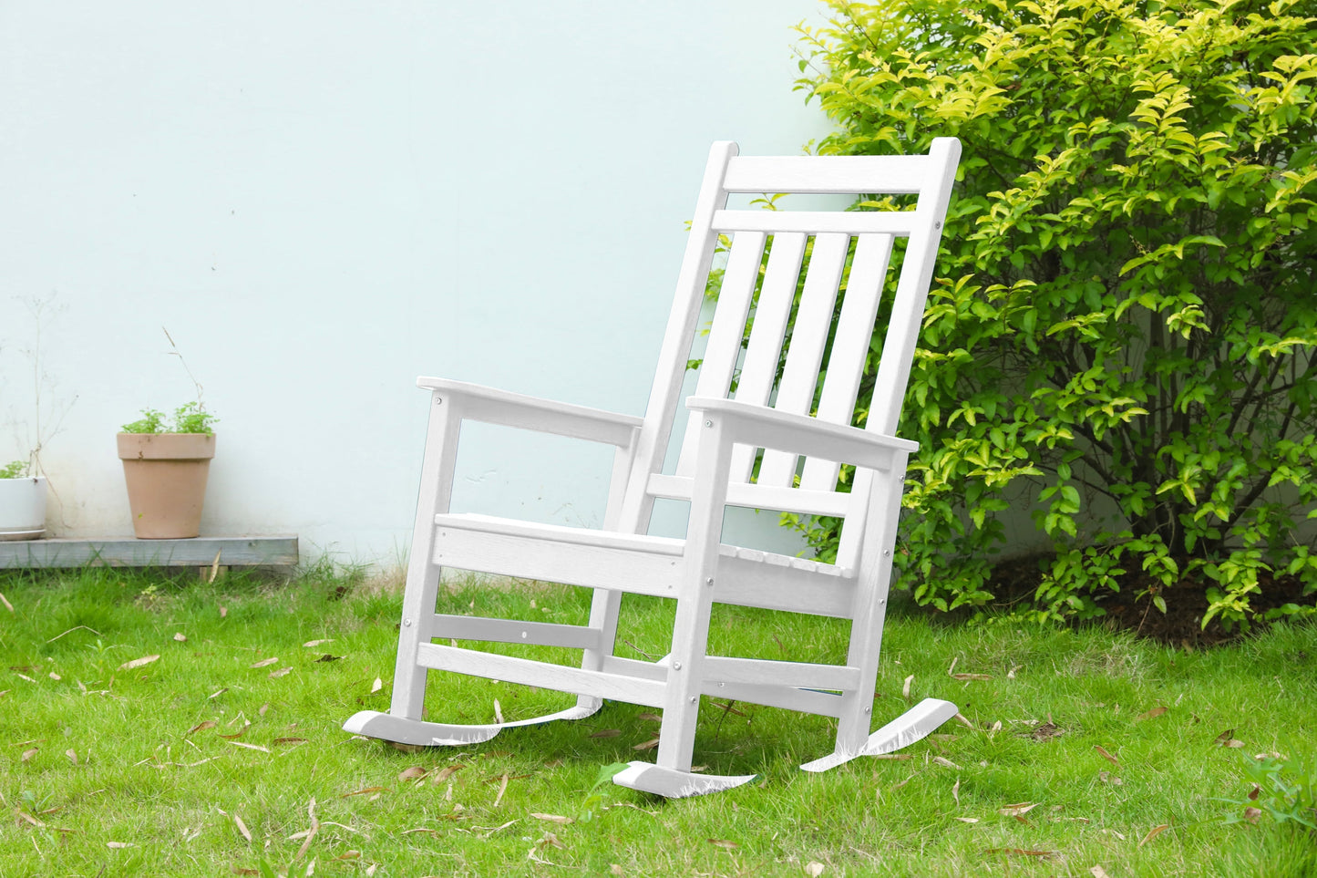 Oversized white wooden rocking chair for outdoor furniture with slatted back and curved rockers on Tampa Home & Garden Store