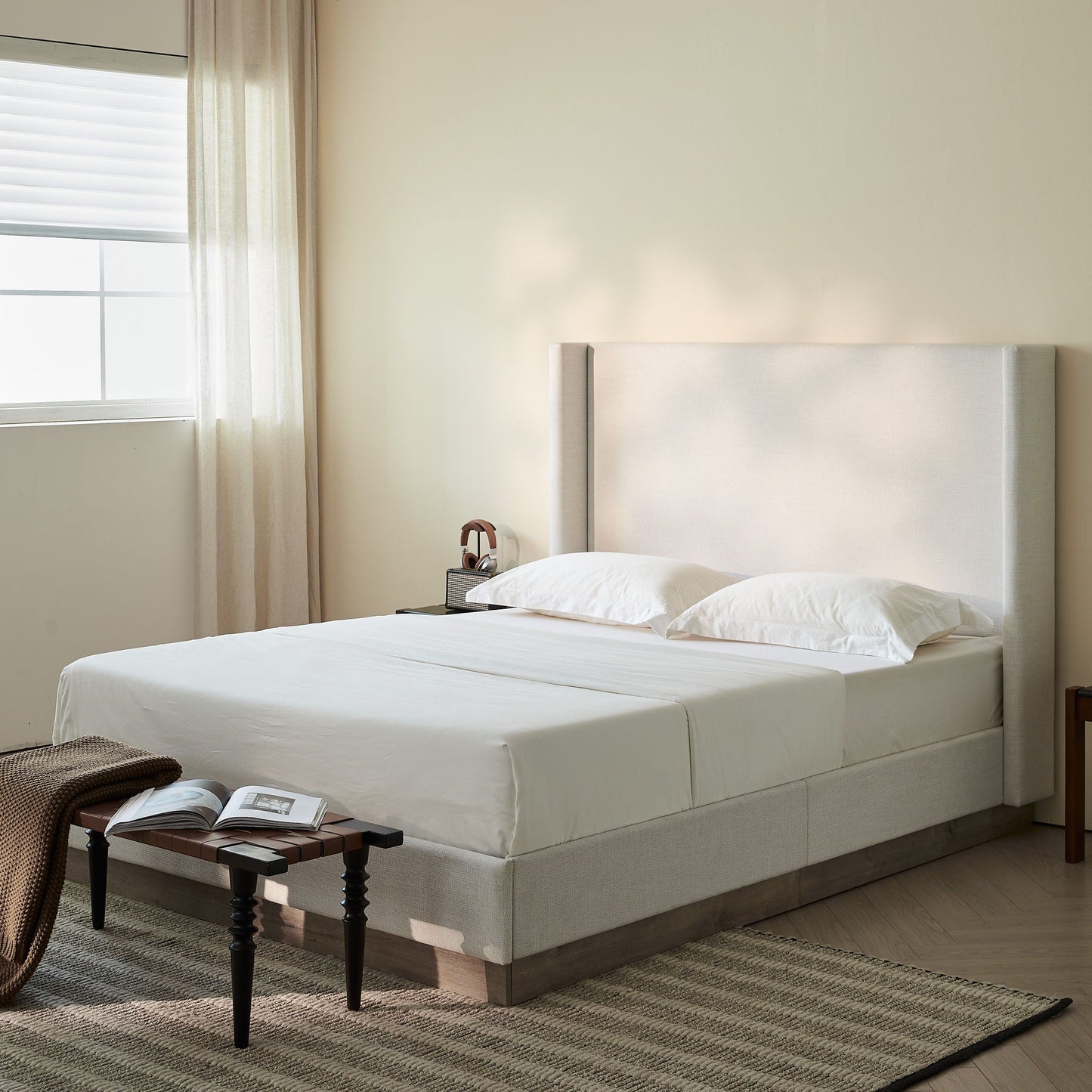 Hosford upholstered wingback bed in beige fabric with tall headboard on Tampa Home & Garden Store