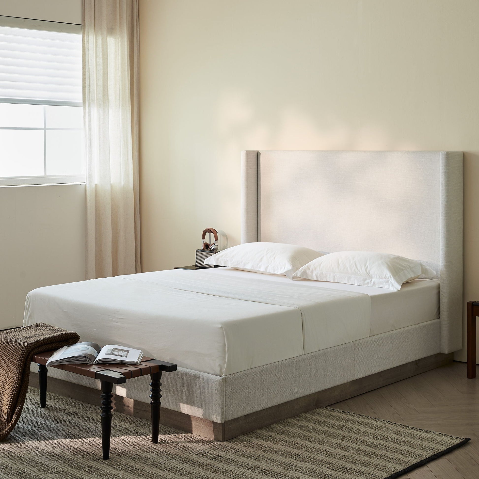 Hosford upholstered wingback bed in beige fabric with tall headboard on Tampa Home & Garden Store