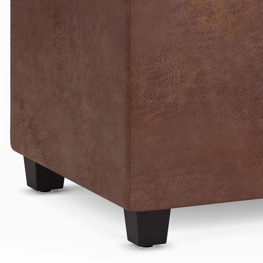 Avalon storage ottoman bench in brown faux leather with black block feet on Tampa Home & Garden Store