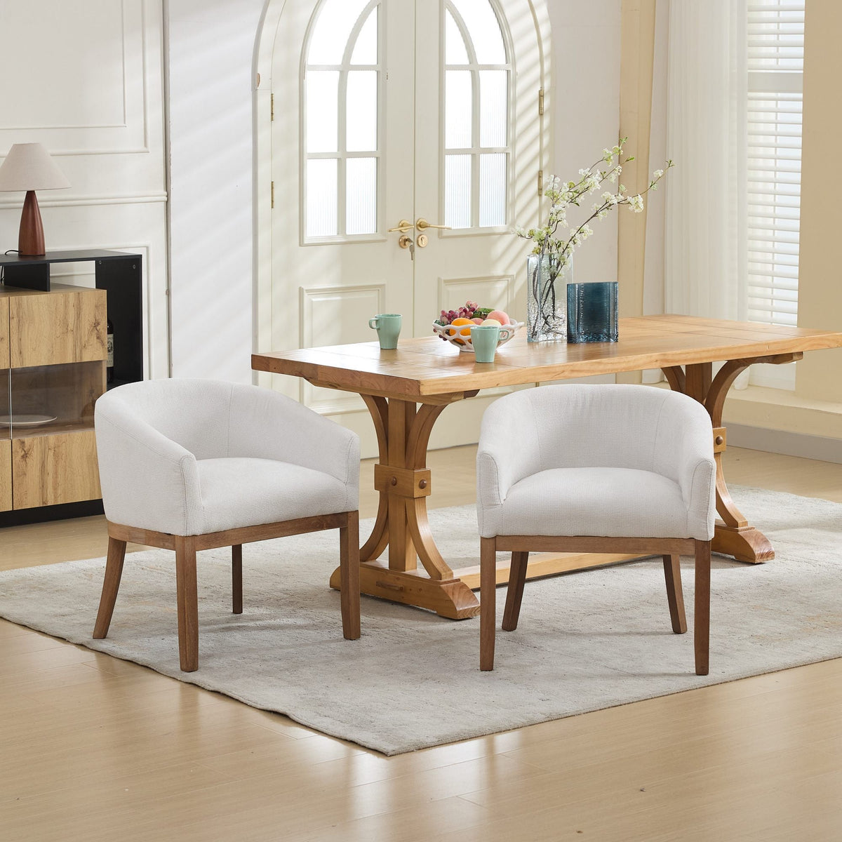 Mid Century Modern upholstered barrel dining chair with arms in light gray fabric and wood legs on Tampa Home & Garden Store