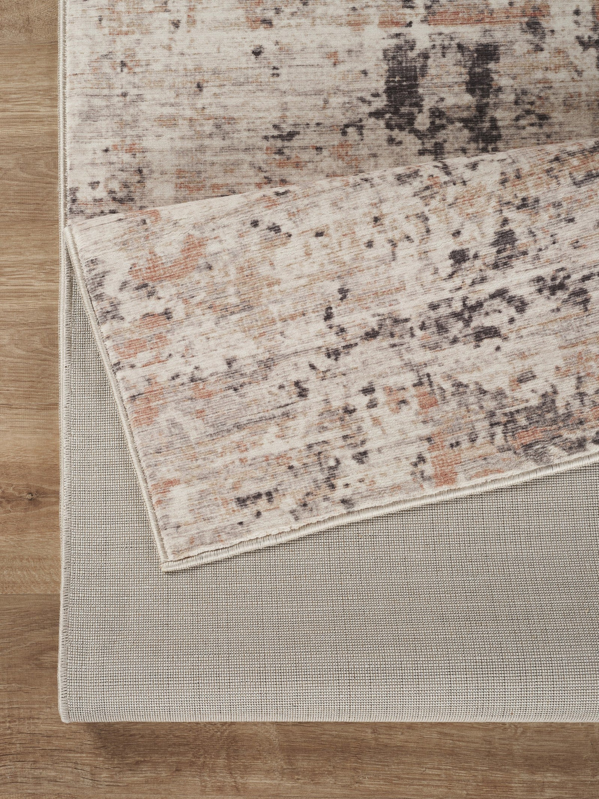 Jewel Abstract Rug HouseOfZazla polyester taupe rust black pattern bound edge on wood floor on Tampa Home & Garden Store