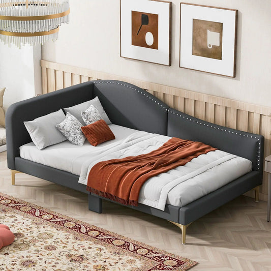 Upholstered daybed with headboard and armrests in dark gray fabric, light wood legs on Tampa Home & Garden Store