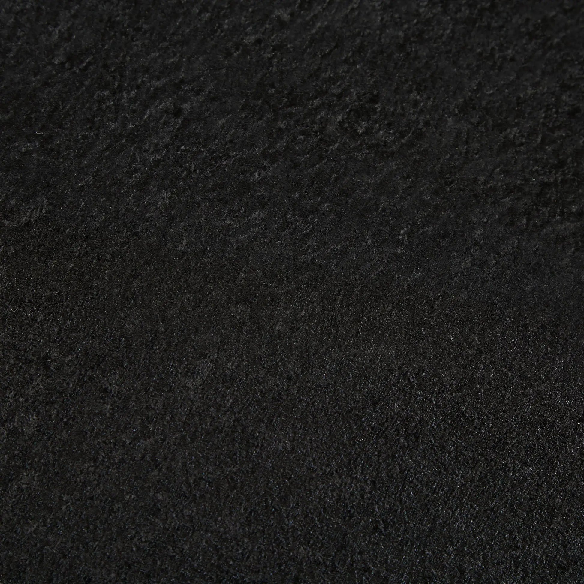 Sleeper loveseat fabric texture in black velvet close-up on Tampa Home & Garden Store