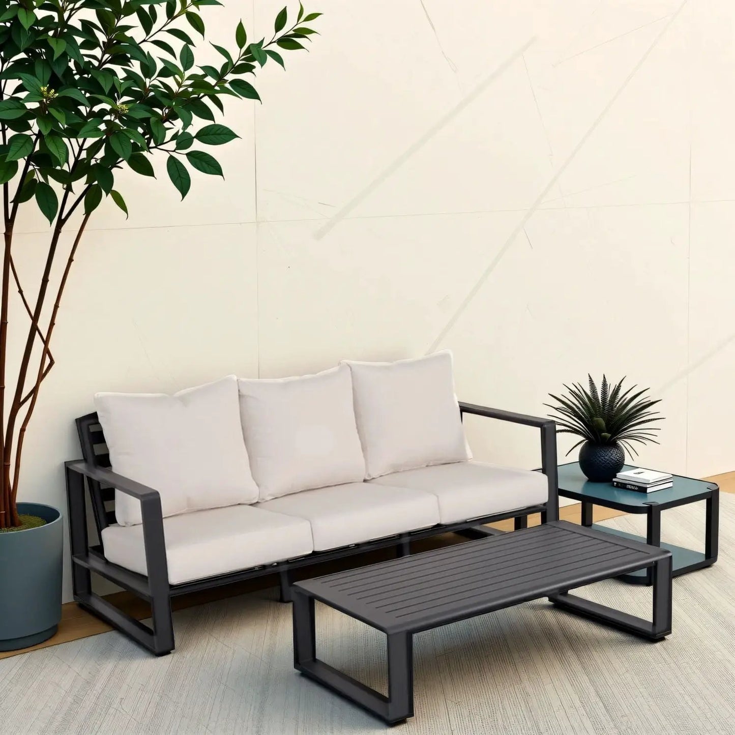 3-person sofa with beige cushions and rectangular coffee table in black metal frame on patio on Tampa Home & Garden Store