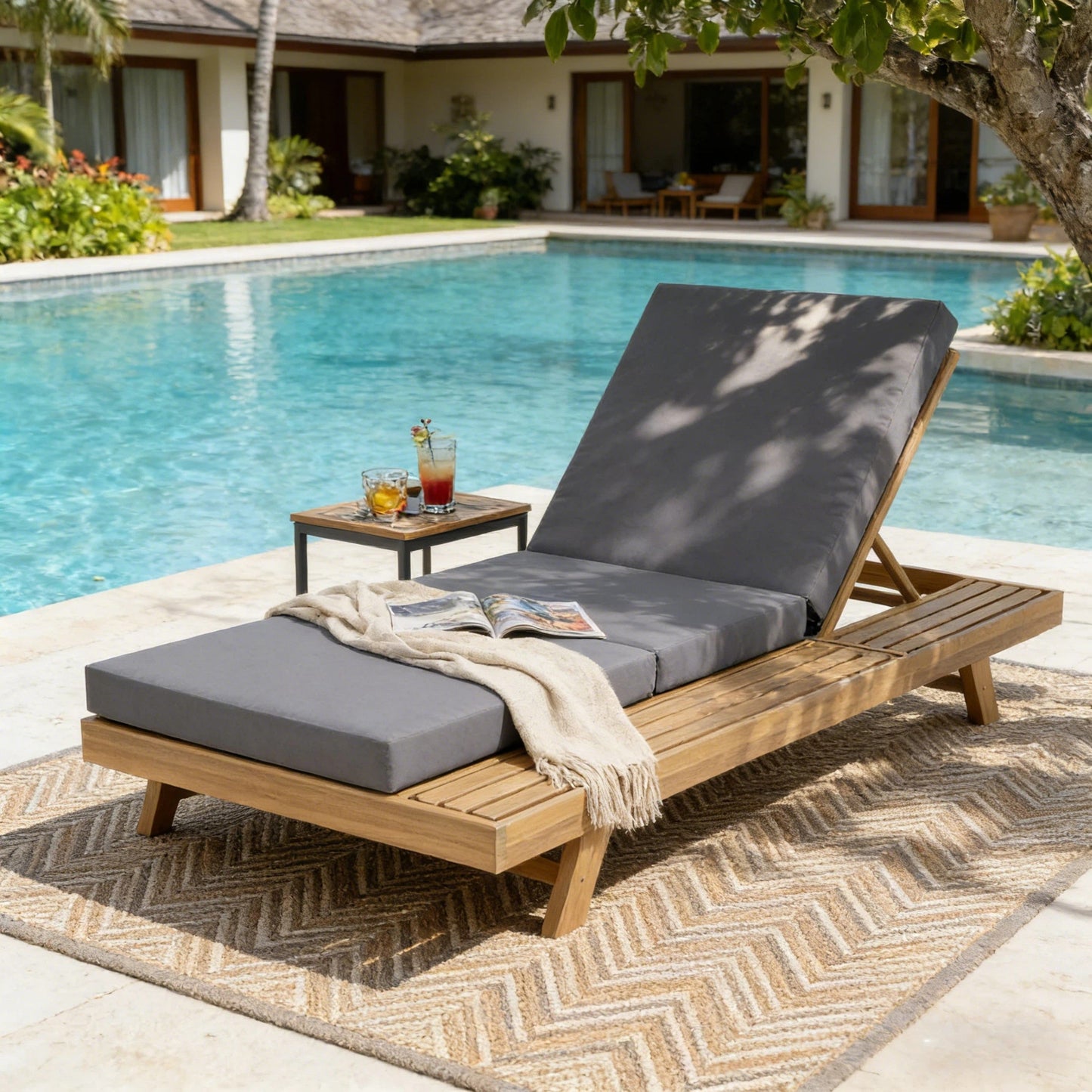 HouseOfZazla outdoor chaise lounge with gray cushion and wooden frame, space on one side by pool on Tampa Home & Garden Store