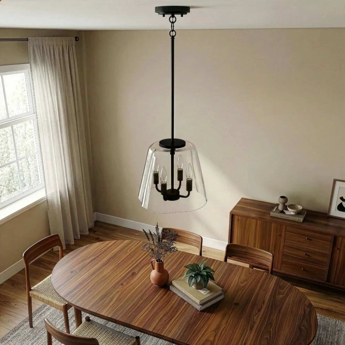 Soiree 4 Candle Lights Pendant by Unique Piece Furniture, black metal fixture with clear glass shade over a wooden dining table on Tampa Home & Garden Store