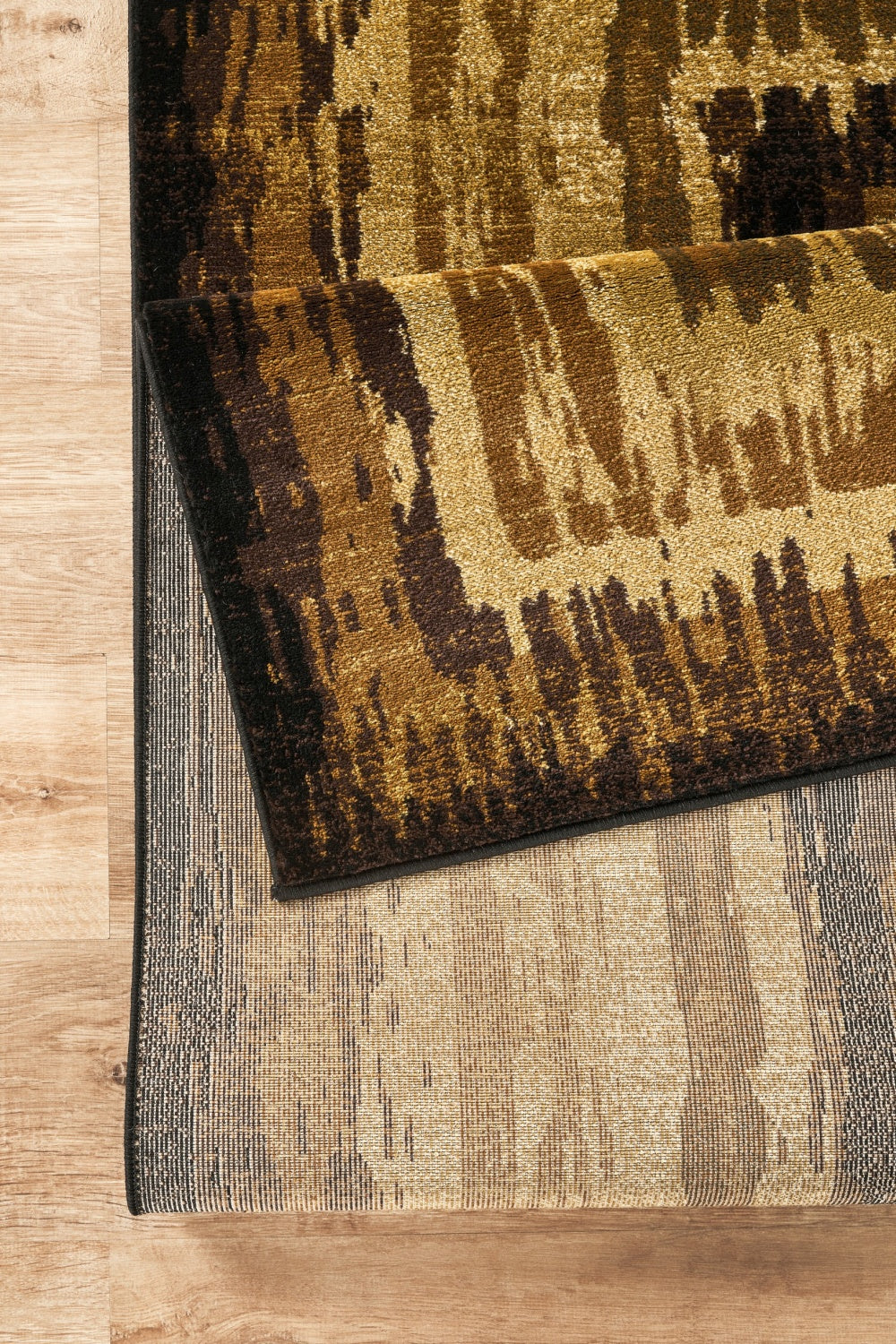 Bristol Abstract Multi-Color Area Rug HouseOfZazla brown beige gold tones on wood floor on Tampa Home & Garden Store