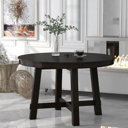 Gia round extendable dining table with 16in leaf in dark wood finish, in a modern dining room on Tampa Home & Garden Store