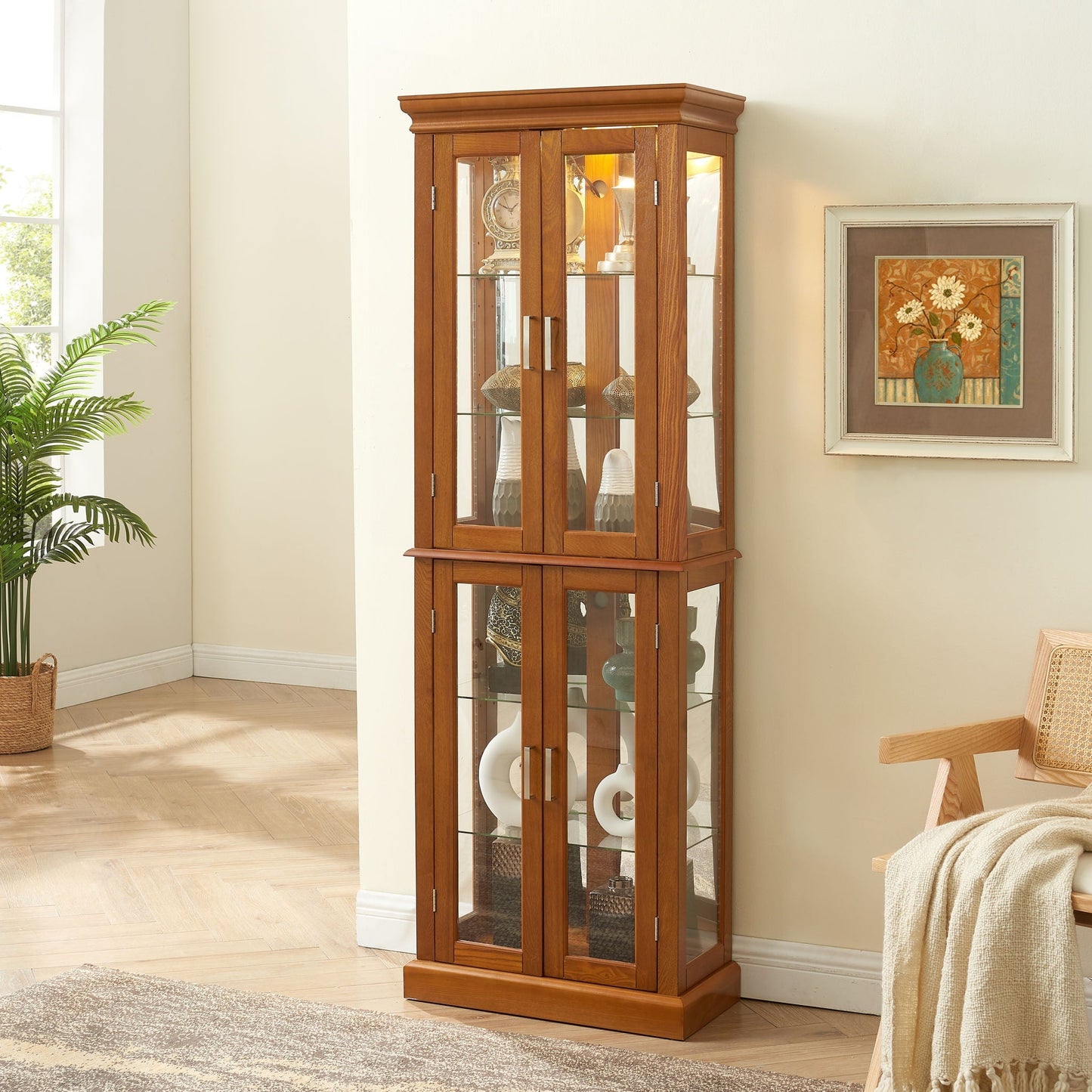 Lighted curio cabinet with glass doors, adjustable shelves, mirrored back panel in wood finish on Tampa Home & Garden Store