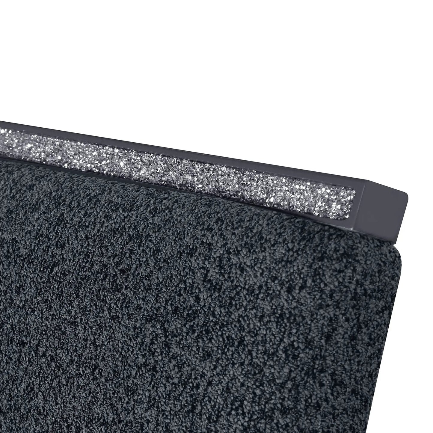 Ariya dining chair close-up with dark charcoal textured upholstery and glitter edge trim on Tampa Home & Garden Store