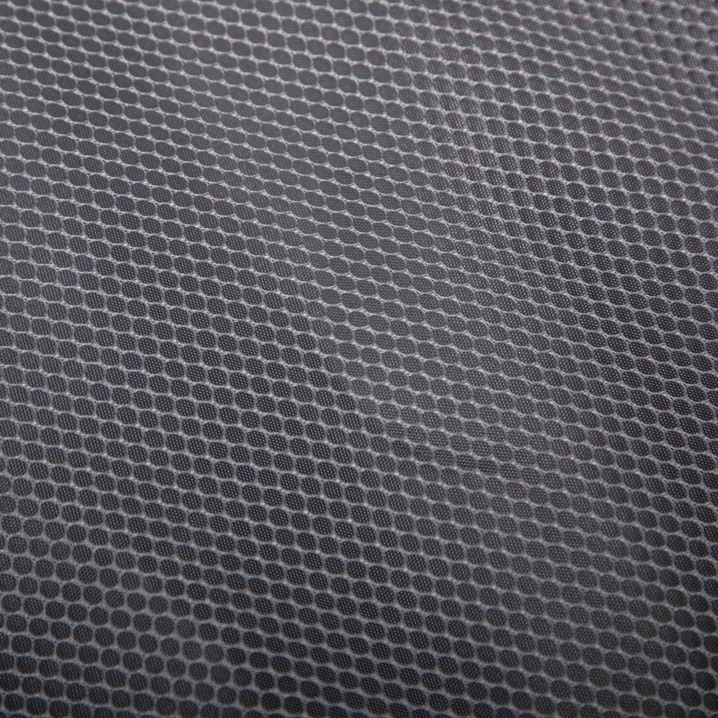 HouseOfZazla luggage fabric close-up in gray with circular dot texture pattern on Tampa Home & Garden Store