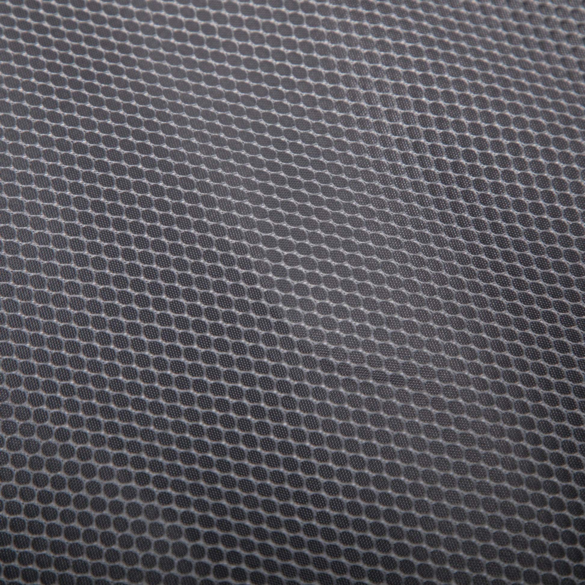 HouseOfZazla luggage fabric close-up in gray with circular dot texture pattern on Tampa Home & Garden Store