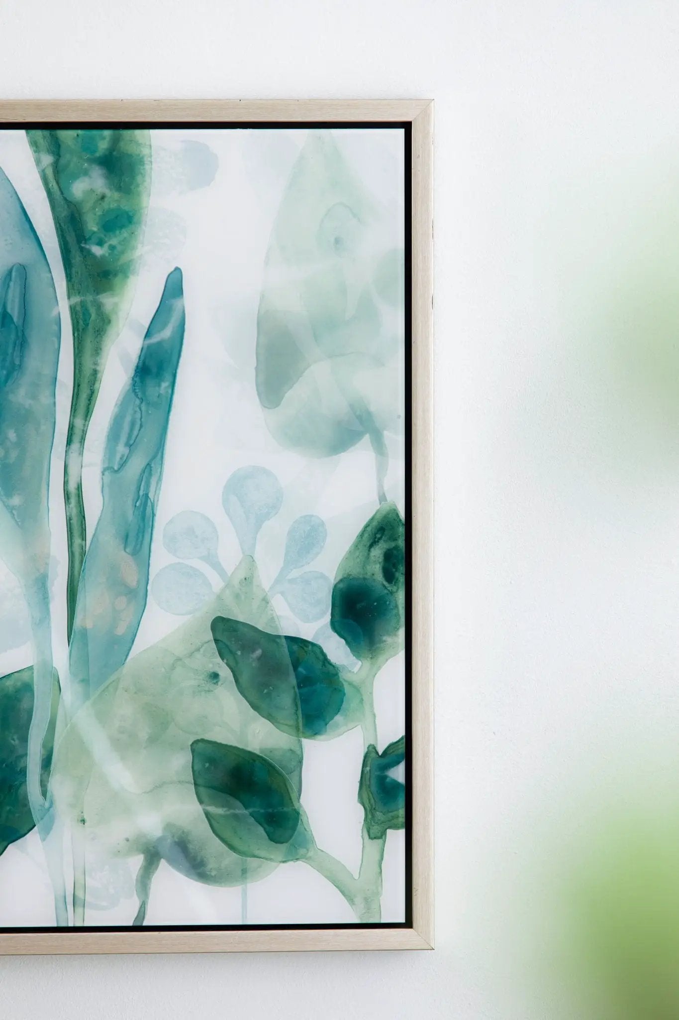 Framed printed acrylic wall art set of 2 with green abstract leaves in light wood frame on Tampa Home & Garden Store