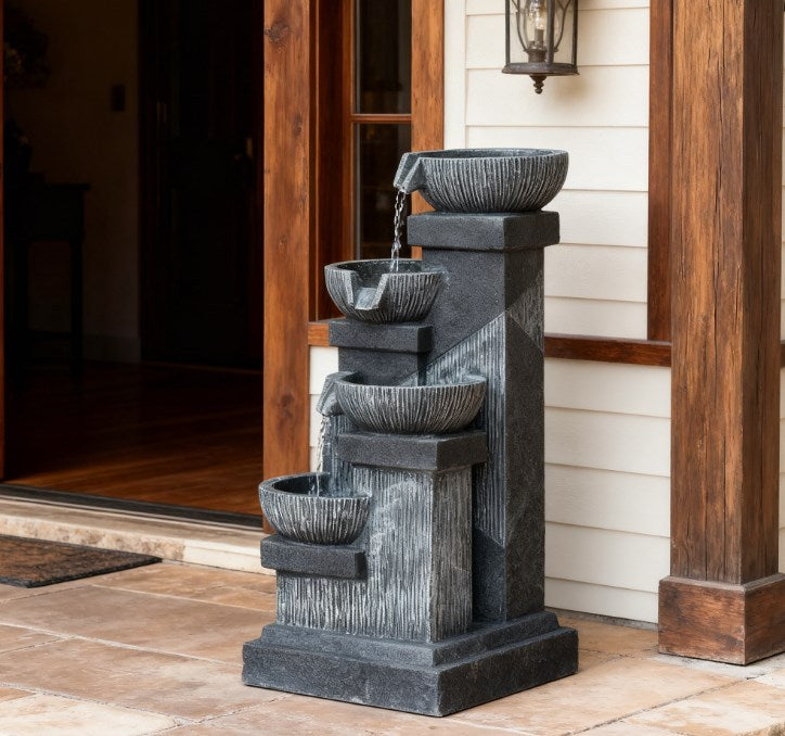 4-Tier Resin Cascading Bowls Outdoor Waterfall Fountain with LED Lights in dark gray on porch on Tampa Home & Garden Store