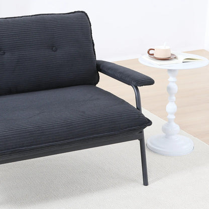 Modern metal-frame sofa with sponge cushions in black beside a white round side table on Tampa Home & Garden Store
