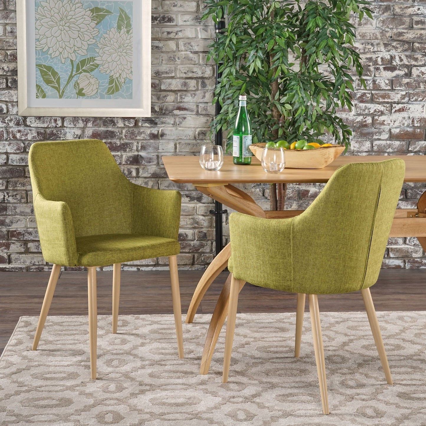 Elegant dining chair with contoured support, green upholstery and light wood legs on Tampa Home & Garden Store
