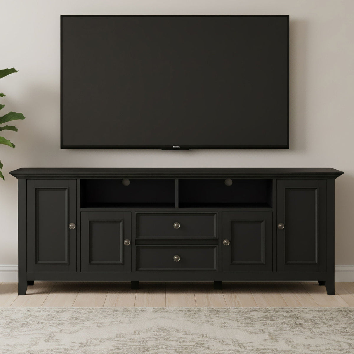 Wide solid wood TV stand in black with open central shelf and side cabinets HouseOfZazla on Tampa Home & Garden Store