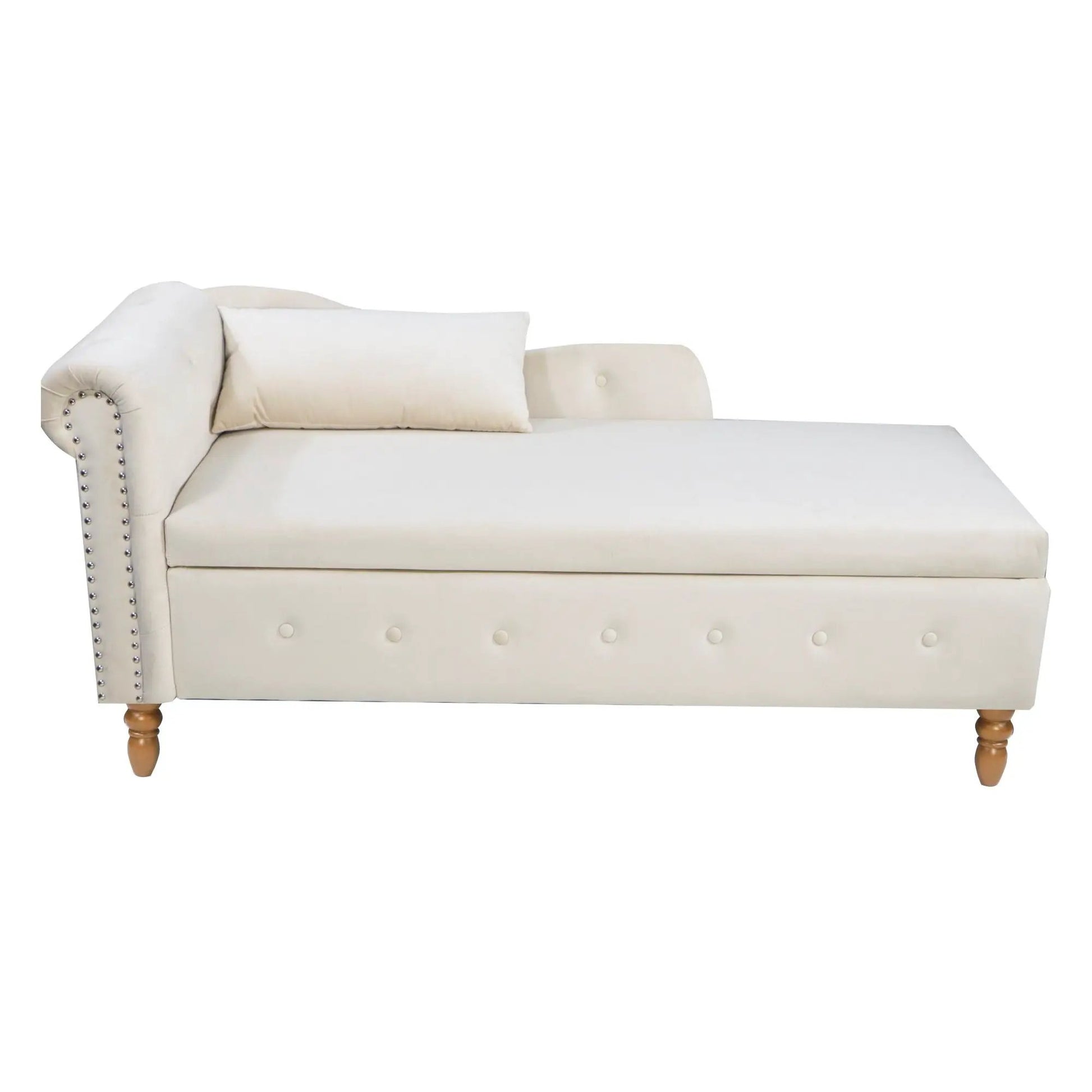 Beige chaise lounge with nailhead trim, curved arm, and tufted base, pillow on wooden legs on Tampa Home & Garden Store