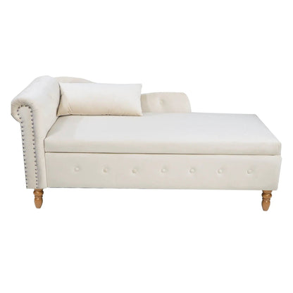 Beige chaise lounge with nailhead trim, curved arm, and tufted base, pillow on wooden legs on Tampa Home & Garden Store