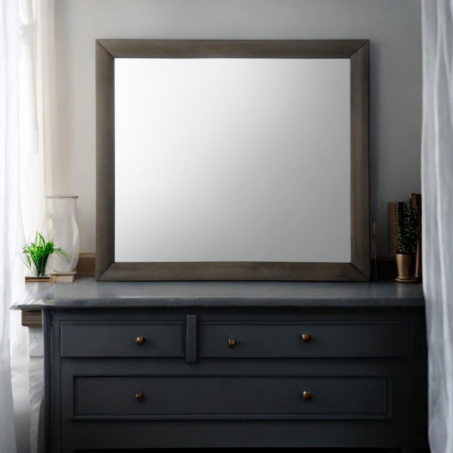 Ireland Contemporary Design Mirror with thick dark wood frame, square shape on a dark dresser on Tampa Home & Garden Store