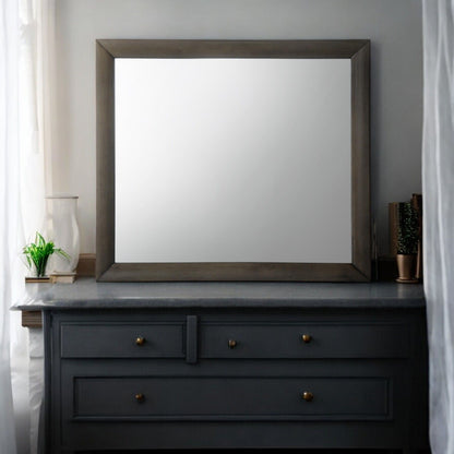 Ireland Contemporary Design Mirror with thick dark wood frame, square shape on a dark dresser on Tampa Home & Garden Store
