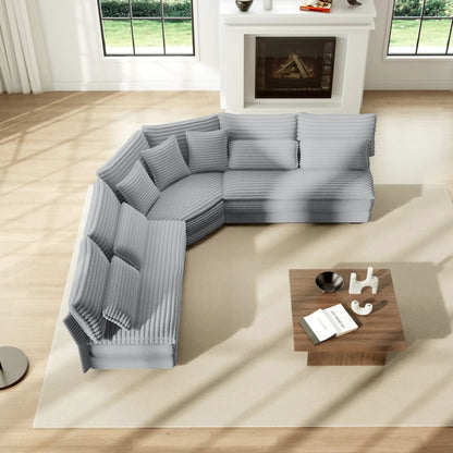 5-seater L-shaped sectional sofa in gray ribbed fabric with curved corner and 7 pillows on Tampa Home & Garden Store